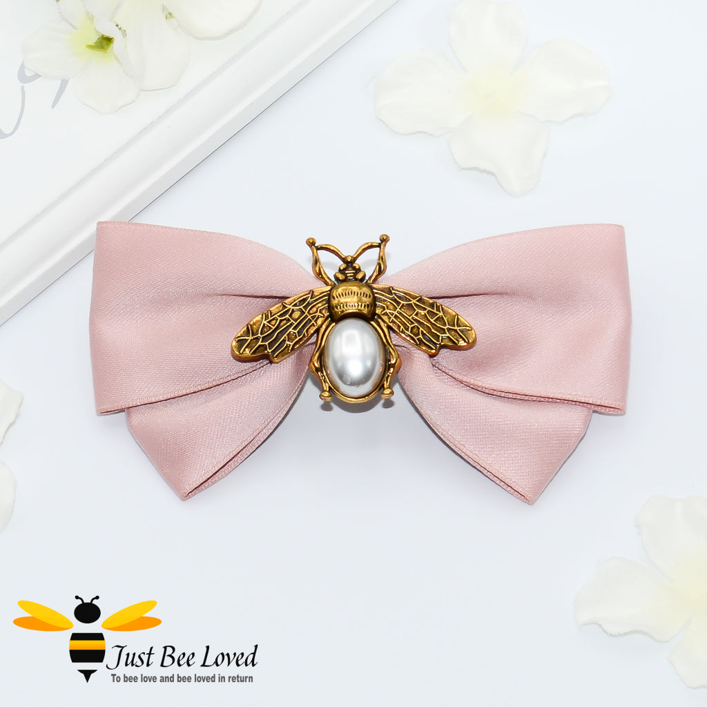 Women's hair bow clip with gold and pearl bees in navy