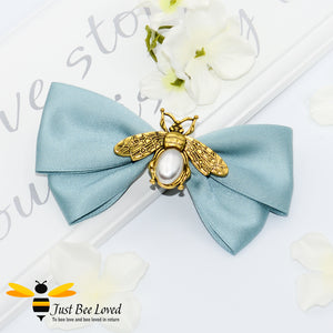 Handmade vintage hair bow clip with gold and pearl bees in navy, green and pink