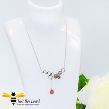 Load image into Gallery viewer, Sterling Silver 925 Necklace with sterling silver bee pendant encrusted with black and orange cubic zirconia on a honeycomb with honeycomb dangle