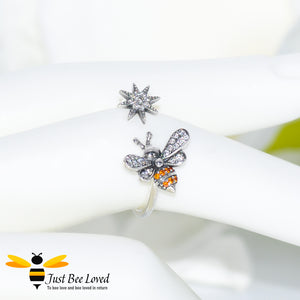 Sterling silver 925 open ring featuring a bee and star with white and orange zirconia
