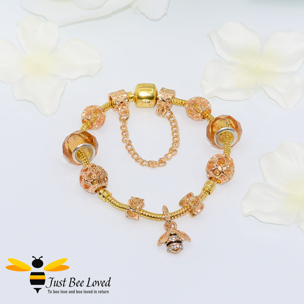 Orange Beads and bee Charm gold colour Bracelet with safety chain.