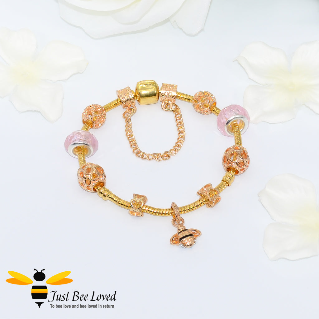 Pink Beads and bee Charm gold colour Bracelet with safety chain.