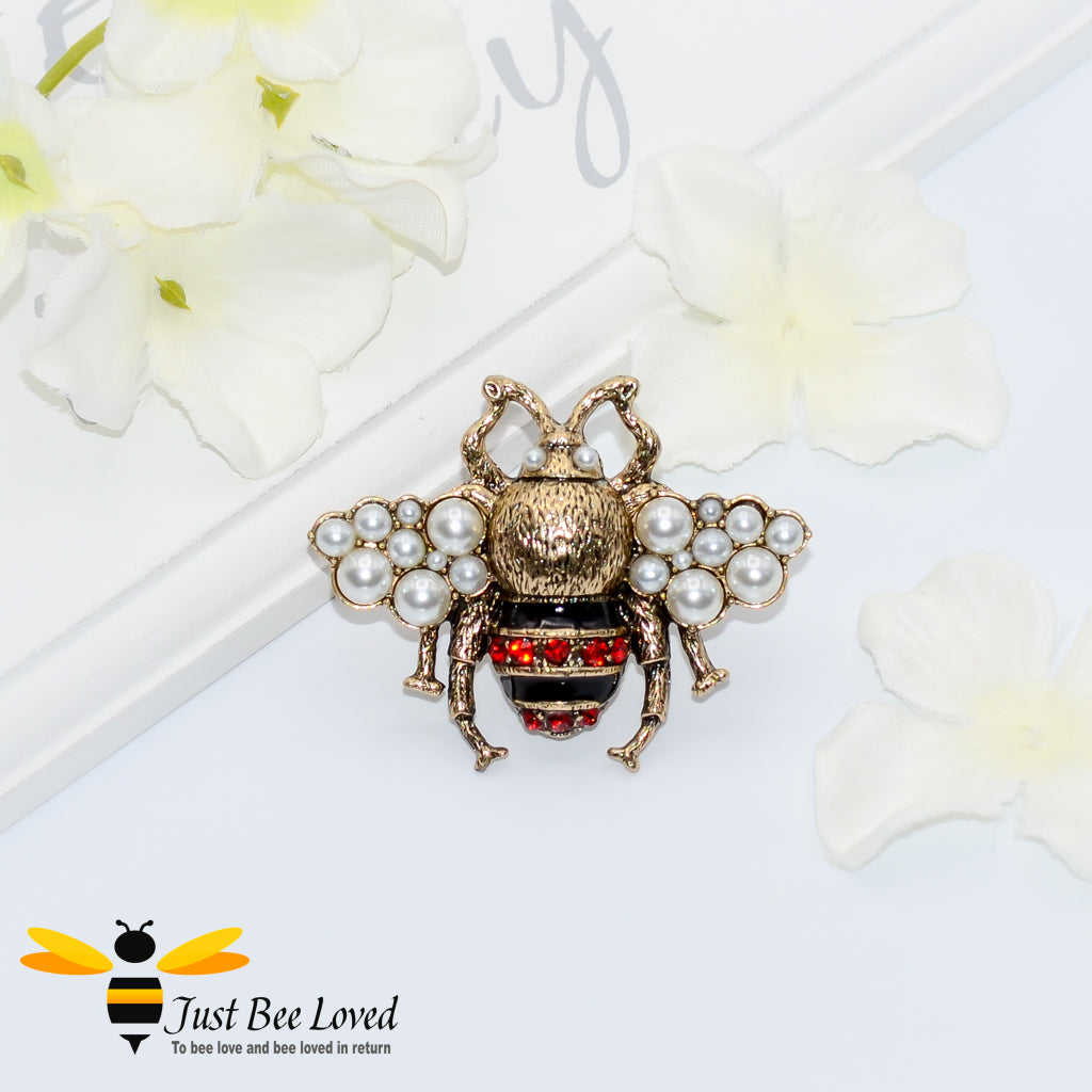 Antique gold bee ring with red crystals and white pearls