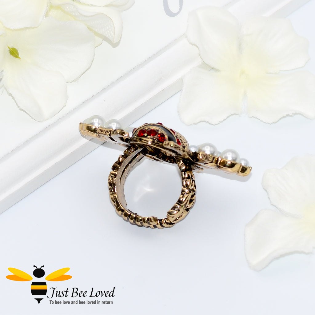 Antique gold bee ring with red crystals and white pearls