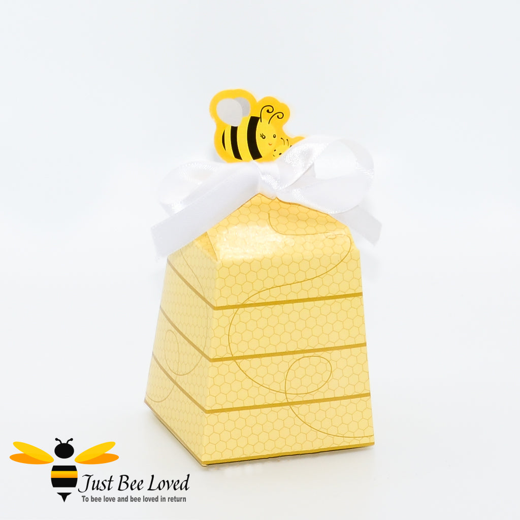 Bee themed party favour gift box with white ribbon.