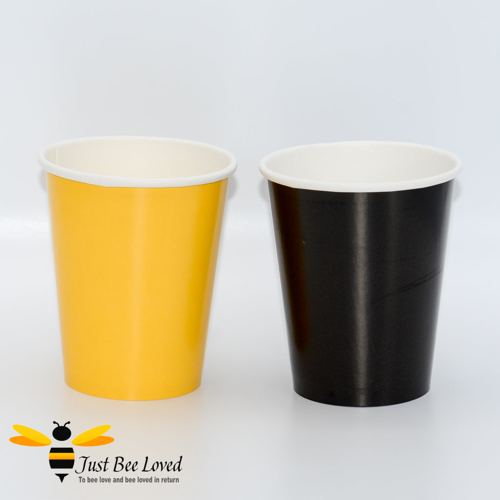 Yellow and black disposable paper party cups