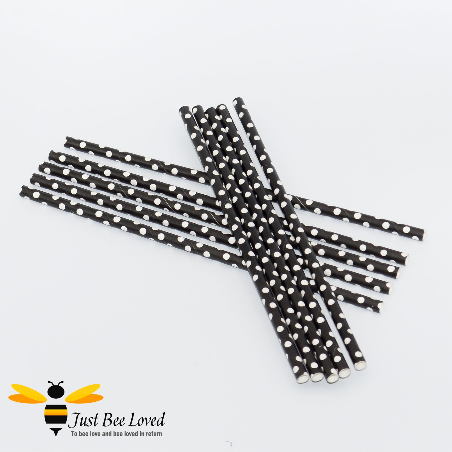 A pack of black and white polka dot paper straws.