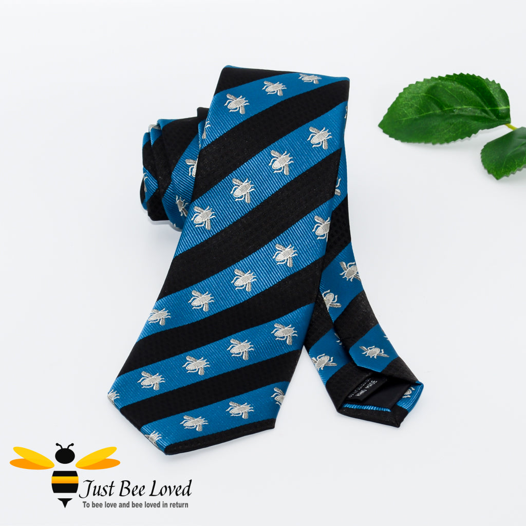 Navy and blue diagonal striped neck tie with grey embroidered bees design