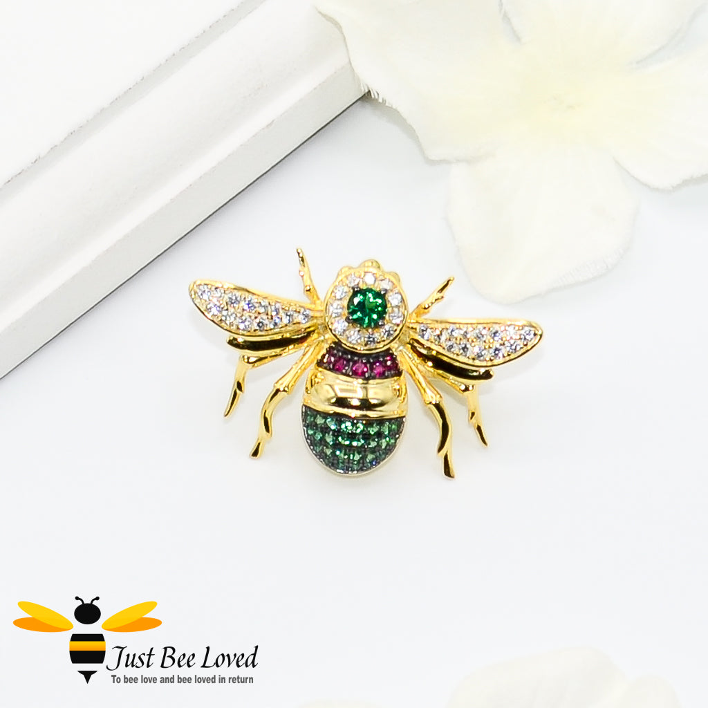 Sterling silver 9ct gold plated bee brooch with rubies, green spinel gemstones and white zirconia crystals