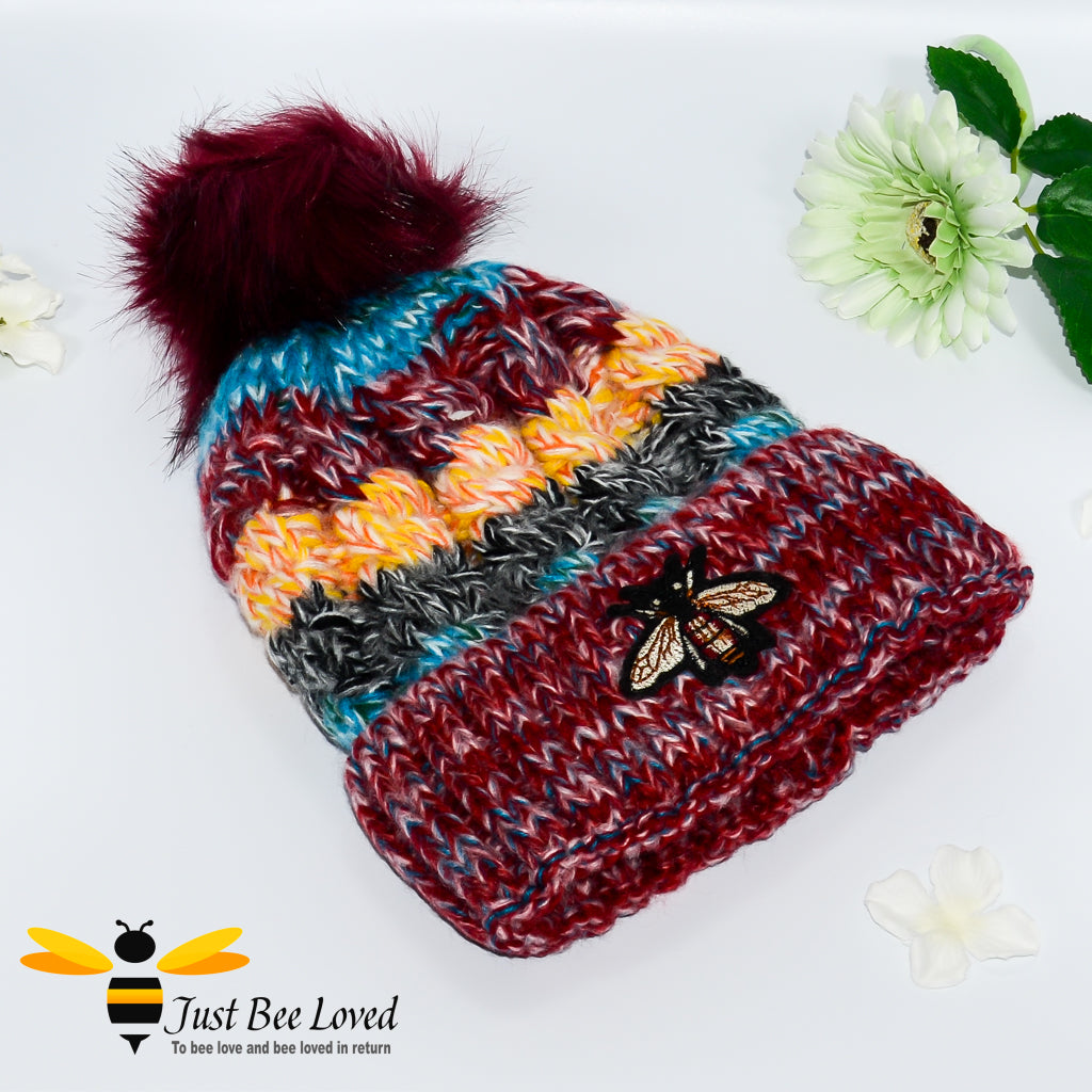 Ladies thick knitted burgundy wool hat with large bumblebee embroidery