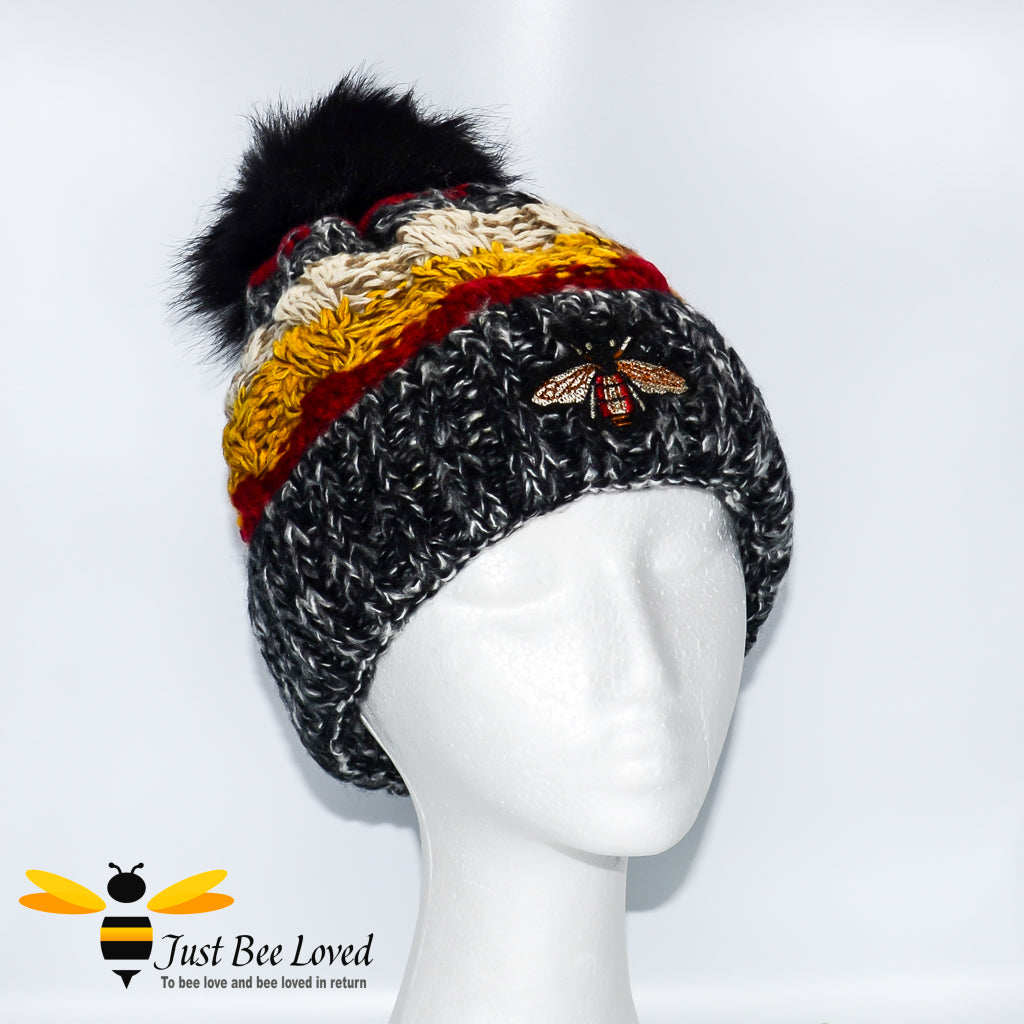 Ladies thick knitted black wool hat with large bumblebee embroidery
