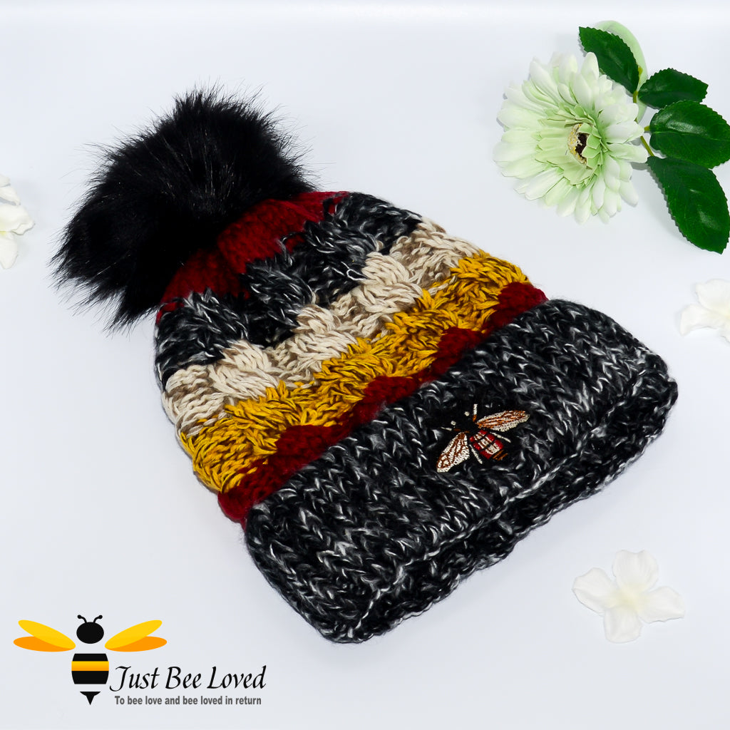 Ladies thick knitted black wool hat with large bumblebee embroidery
