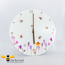 Load image into Gallery viewer, Glass Wall Clock featuring watercolour design of bumblebees in a field of flowers from the Jennifer Rose Busy Bees Leonardo Collection