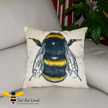 Load image into Gallery viewer, Large linen scatter cushion featuring a colourful sketch of a bumblebee against natural cream background
