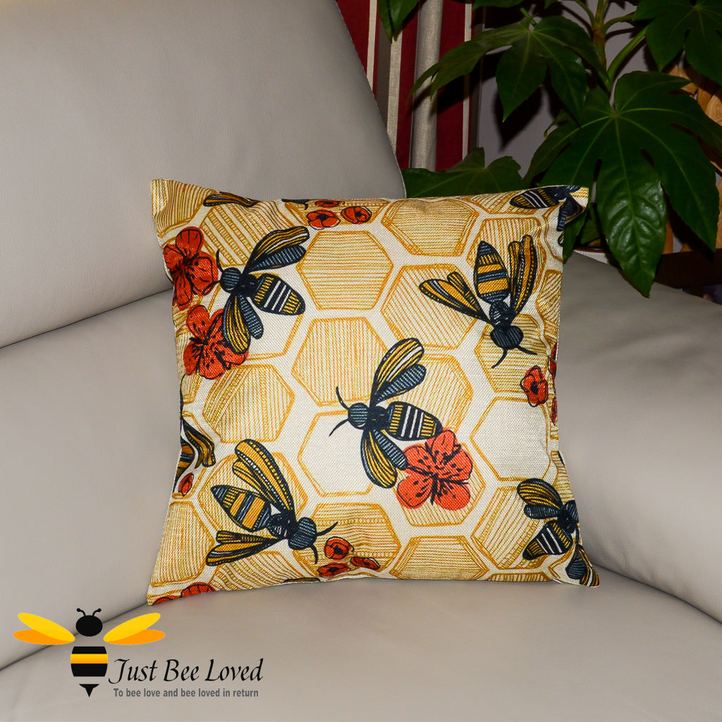 Scatter cushion featuring honey bees and poppies with an orange honeycomb hexagonal background