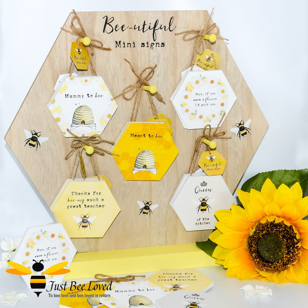 A collection of wooden mini message signs with bee-themed decorations, featuring various messages such as 'Mummy to Bee', 'Queen Bee of the Kitchen', and 'Meant to Bee'.