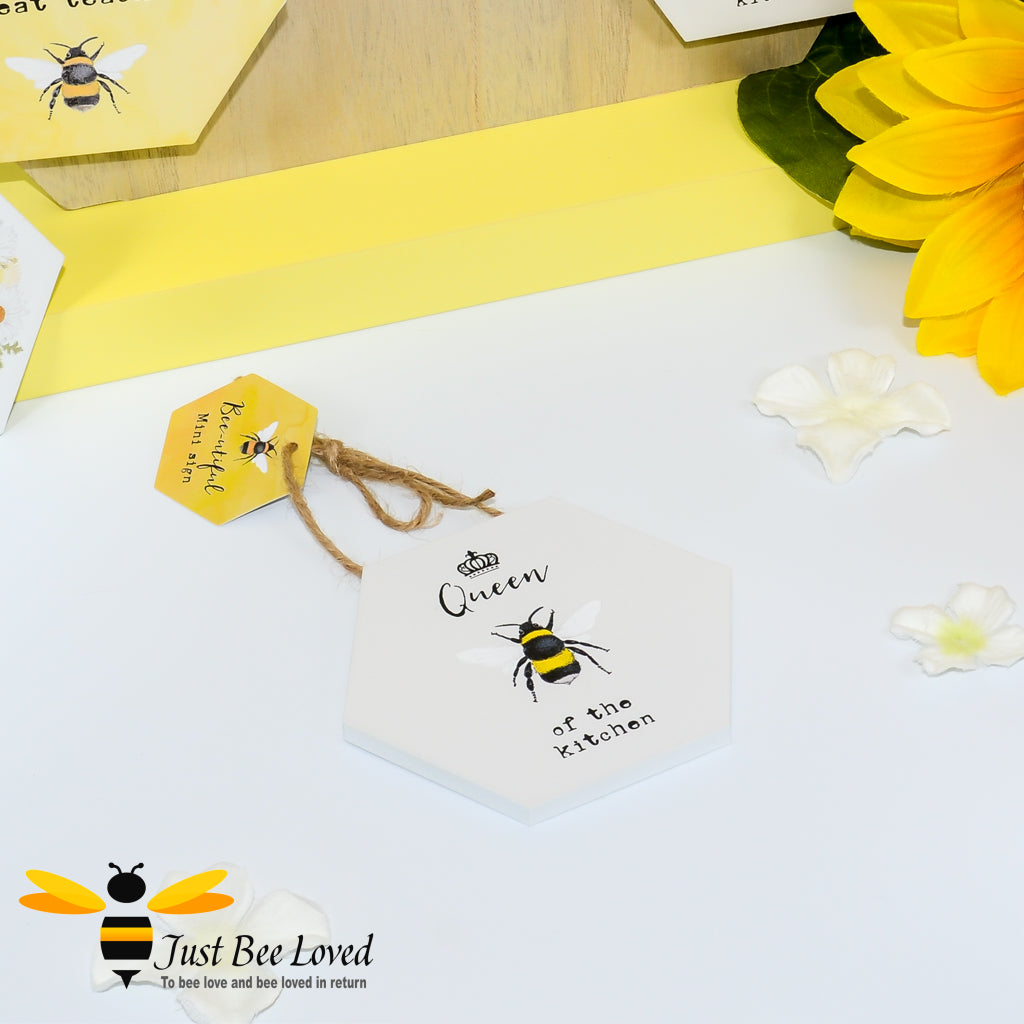 Bee themed hexagonal shaped wooden mini sign with "queen bee of the kitchen" text.