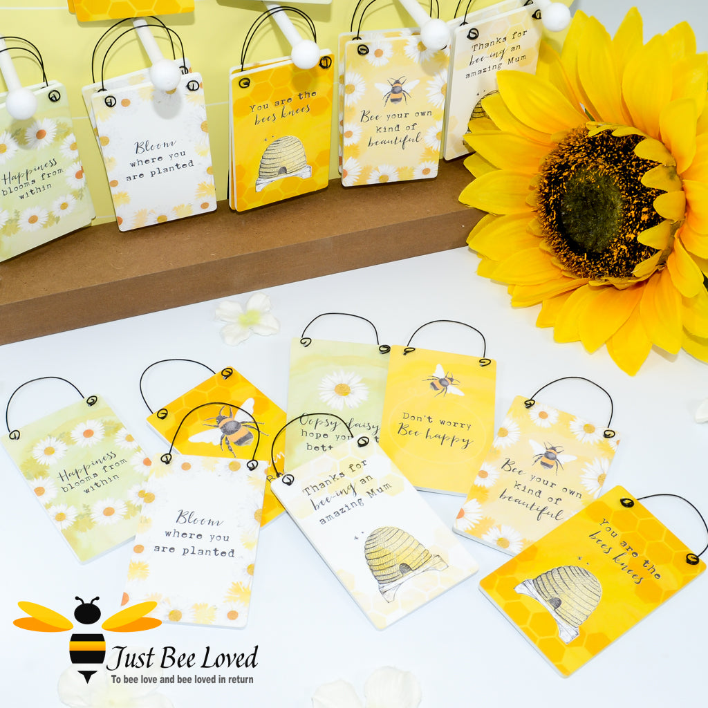 A collection of yellow wooden mini cards with bee-related graphics and various messages such as 'You are the bees knees' and 'Bee your own kind of beautiful'.