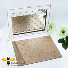 Load image into Gallery viewer, set of two glass mirrored placemats decorated with glittering bees on the front face and glittering gold underside. 