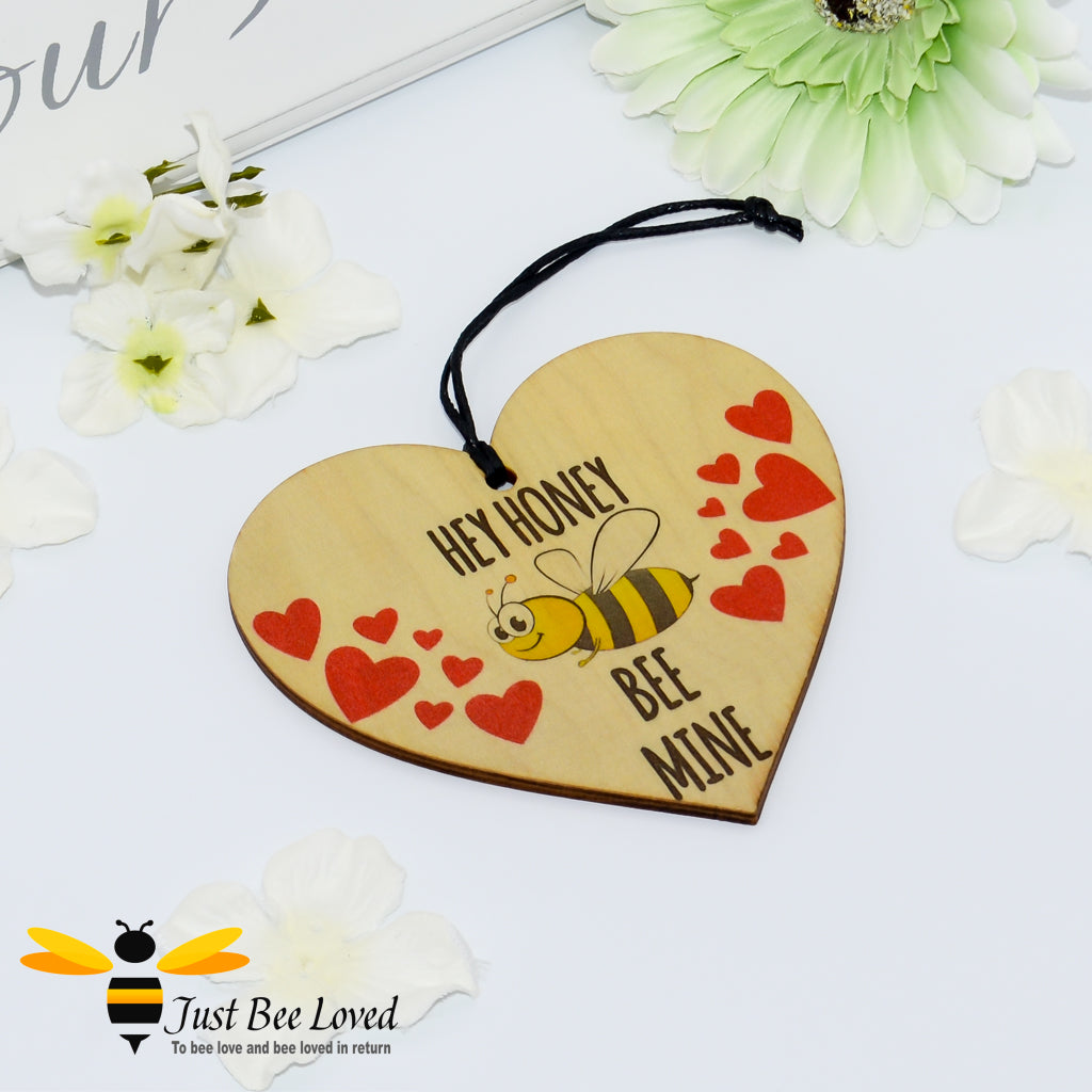 Heart shaped wooden hanging mini plaque with 'hey honey bee mine' text, a smiling bee and red hearts.