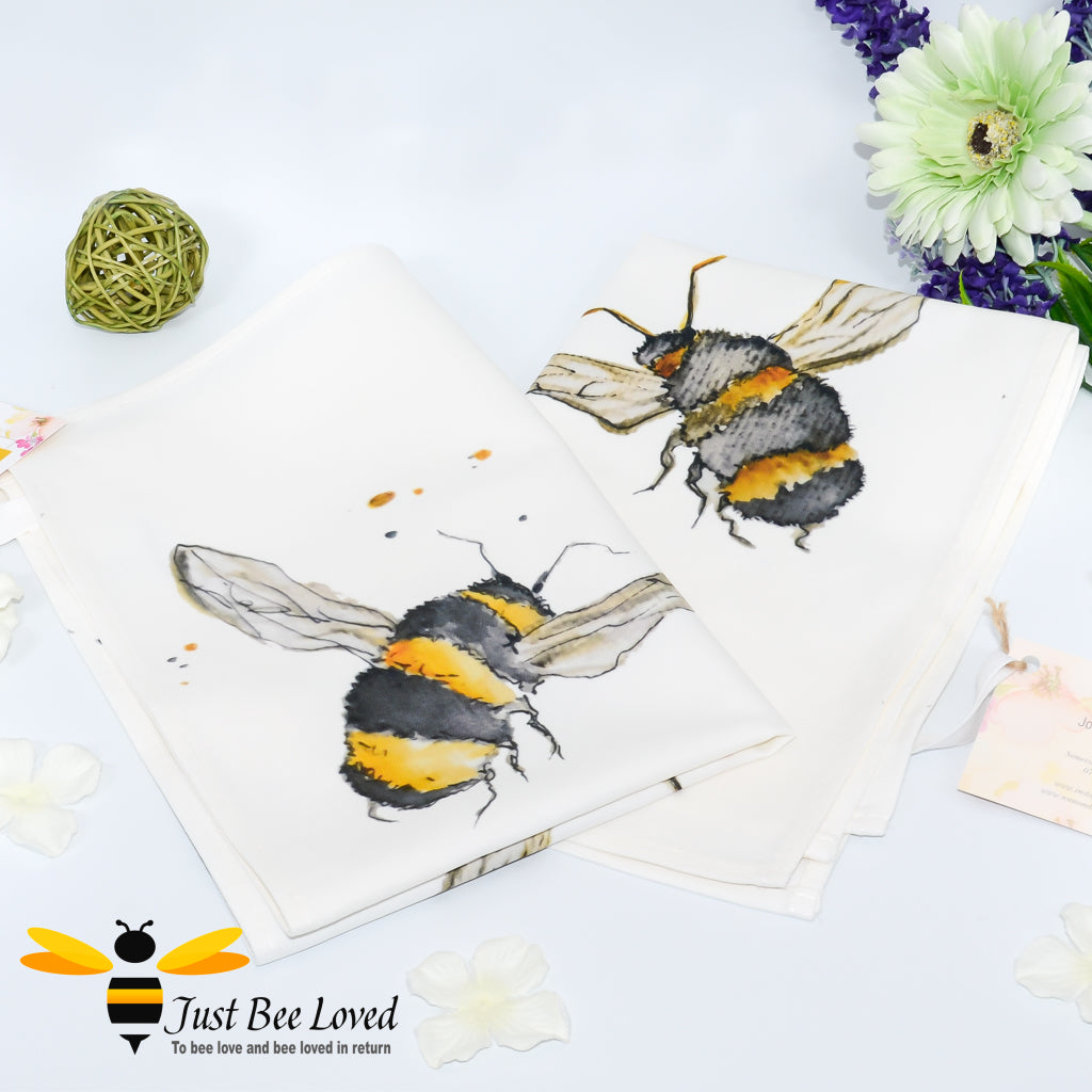 luxurious cream coloured cotton tea-towel featuring bumblebees in flight art work by British artist Joanna Williams.