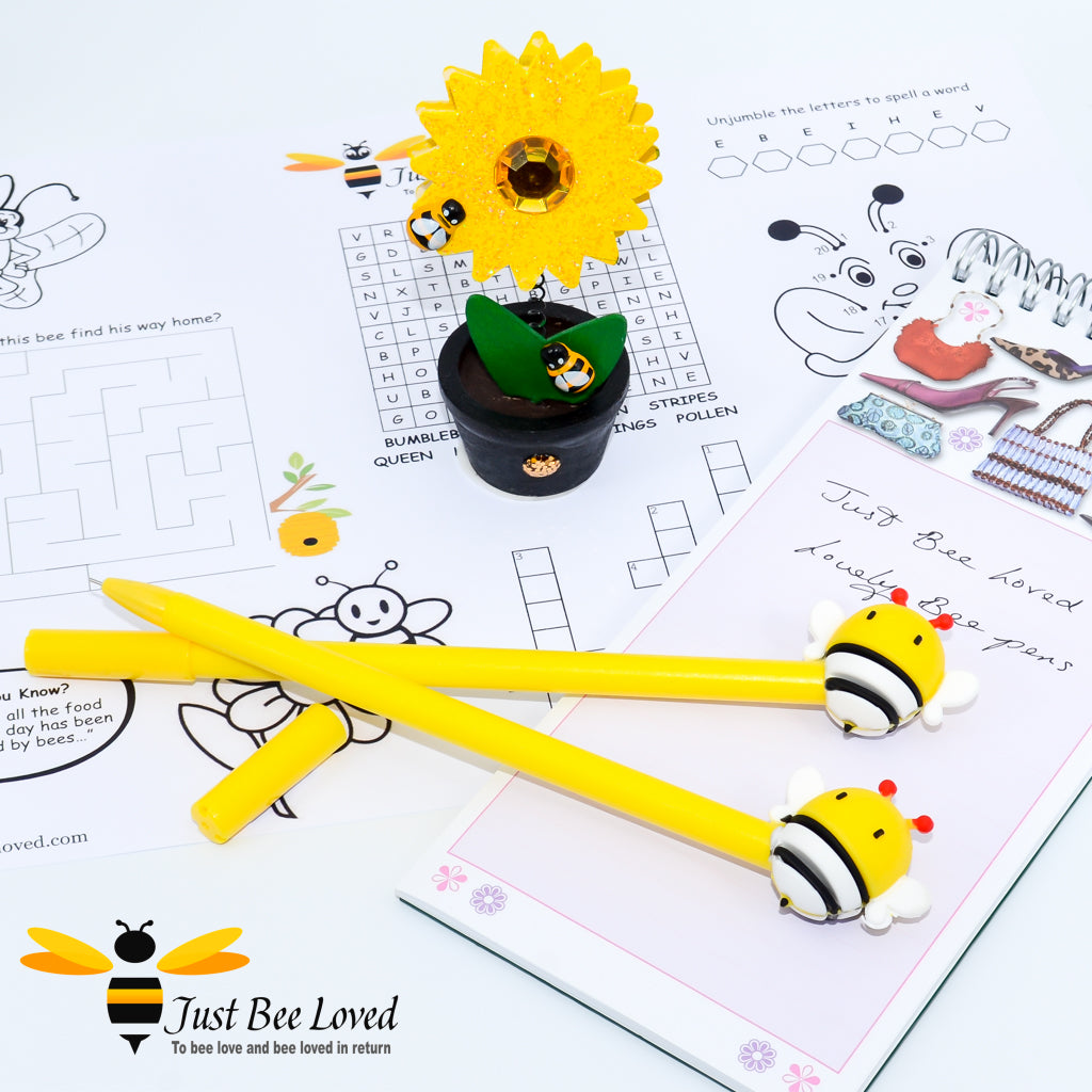 A set of two yellow novelty rubber cartoon bee pens.
