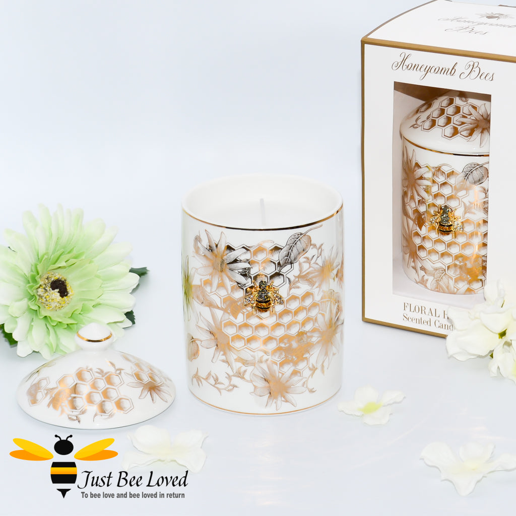  scented candle with a floral fragrance infused with honey; encased within an ivory fine China jar decorated with golden honeycomb and flowers with bee embellishment. 