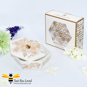 Fine china accessory trinket box decorated with golden honeycomb, bees and flowers, with a rhinestone bee embellishment.