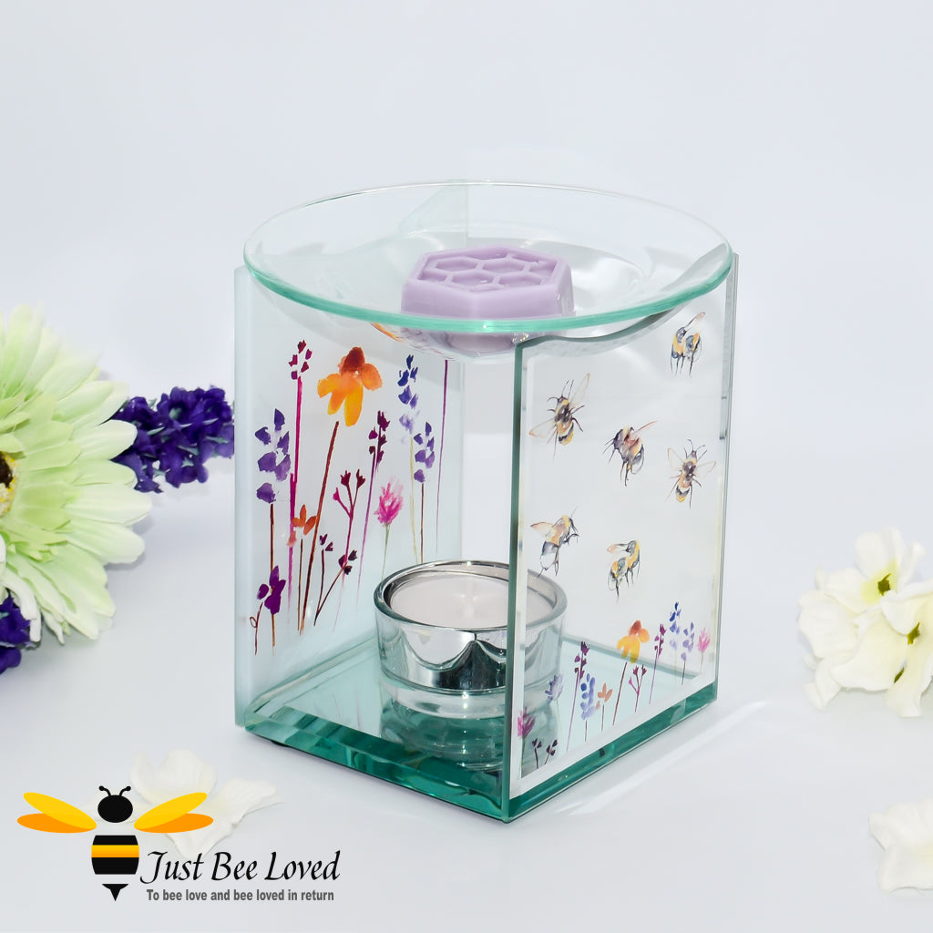 glass oil & wax melt burner featuring a clear front face decorated with flying bumblebees and matching lavender flowers on back. 
