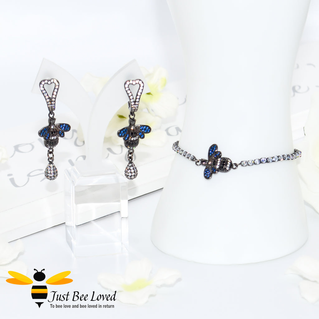 handmade rhinestone encrusted sliding bee bracelet with matching bee drop earrings.