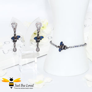 handmade rhinestone encrusted sliding bee bracelet with matching bee drop earrings.
