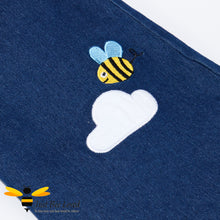 Load image into Gallery viewer, denim long sleeved square neckline ruffle dress featuring adorable applique bumblebee and smiling rainbow sun