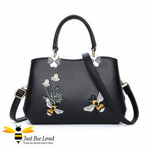 Hand embroidered bumblebees flowers faux leather handbag in black colour