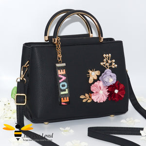 hand-crafted 3D embellished PU leather shoulder handbag featuring a cluster bouquet of colourful flowers, golden leaves with a pearlised bee in black colour