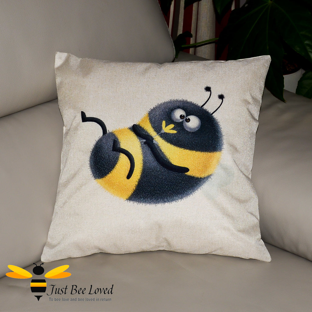 Beige coloured scatter cushion featuring a playful cute bumblebee holding a flower.