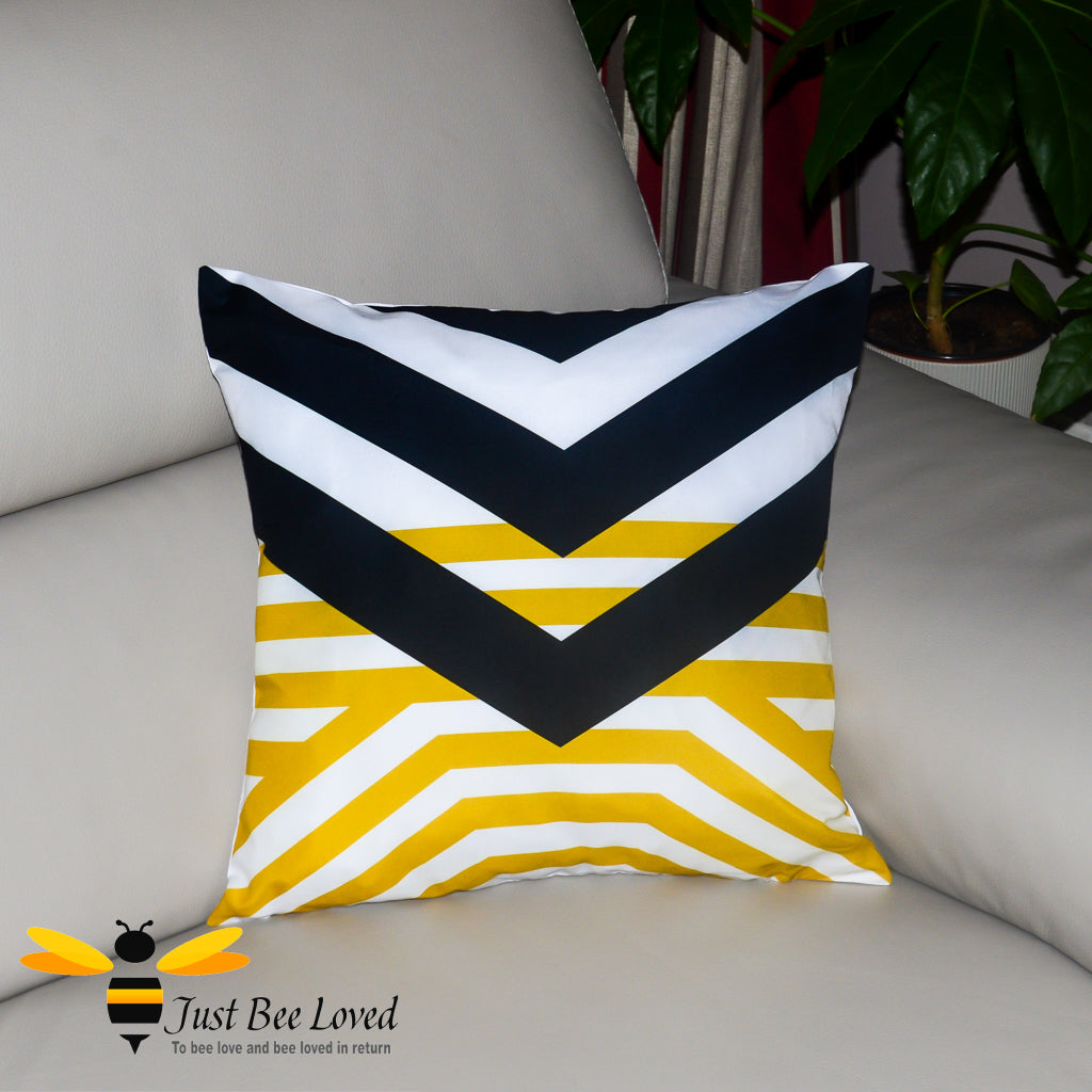 Contemporary styled cushion featuring a black and yellow geometric design on a white background.