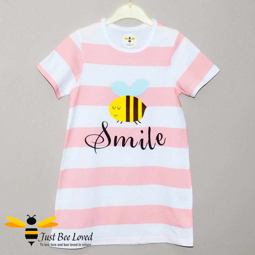 girl's pink & white striped nightdress featuring a cartoon bee with 