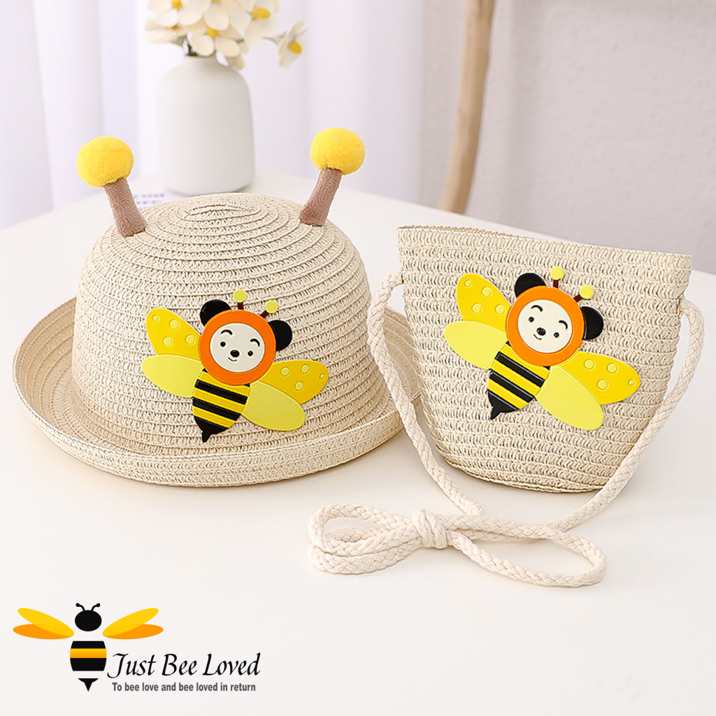 natural matching beige straw hat and handbag set each decorated with a colourful applique bumblebee; hat features bee antennae