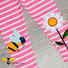 Load image into Gallery viewer, Girls pink striped leggings featuring colourful bumblebee and flower appliques at the knees.