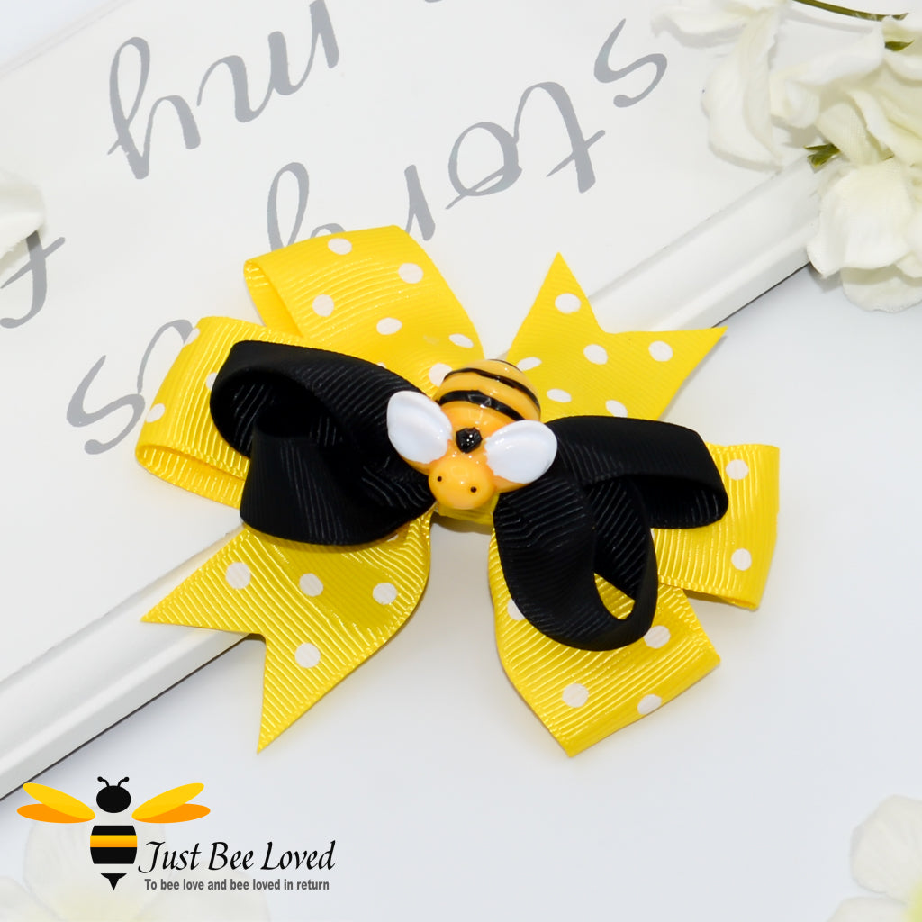 ribbon bow hair clip featuring a bumblebee on a pre-tied black and yellow & white polka dot double bow.