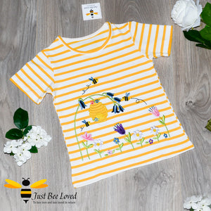 Girl's summer yellow striped T-shirt embroidered with honey bees, beehive and flowers.