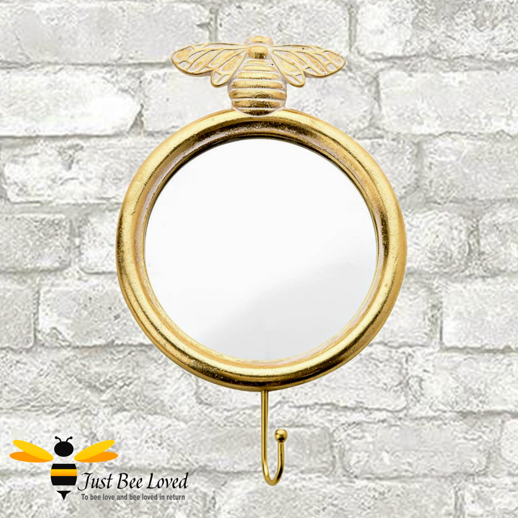 Gilded gold round mirror with hanging wall hook and brass bee feature