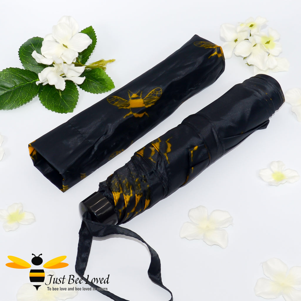 Black foldable mini umbrella with gold bees print