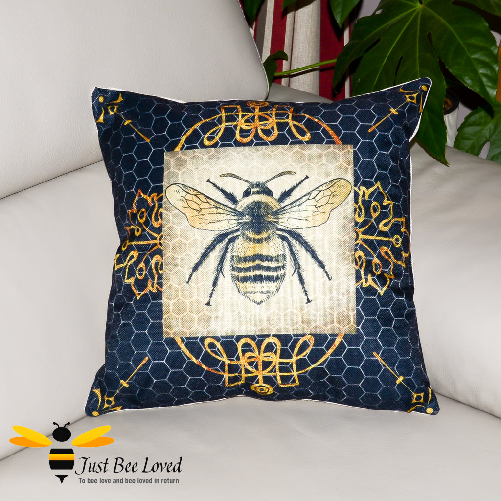 navy scatter cushion featuring a golden bumblebee on a honeycomb background with gold leaf design.