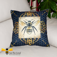 Load image into Gallery viewer, Large navy scatter cushion featuring a golden bumblebee on a honeycomb background with gold leaf design.