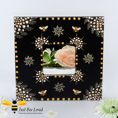 Hand painted wood black mirror featuring an original mandala design of gold and white with golden bumblebees.