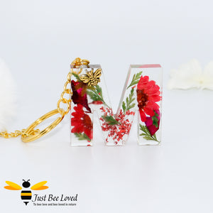 hand-crafted resin letter bee keyrings made with real pressed dried florals. Letter M