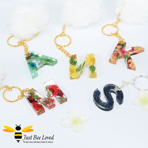 hand-crafted resin letter bee keyrings made with real pressed dried florals