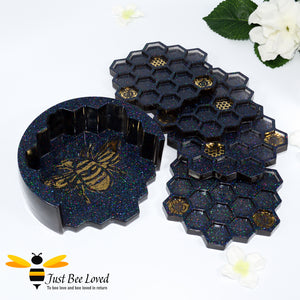 Set of 4 handmade resin honeycomb bumblebee coasters with matching holder in black and gold.
