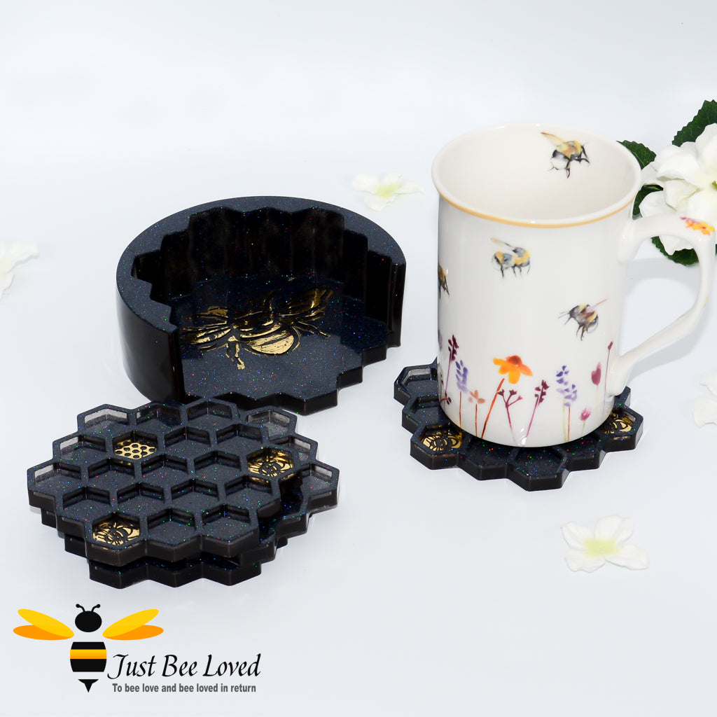 Set of 4 handmade resin honeycomb bee coasters with matching holder in black and gold.
